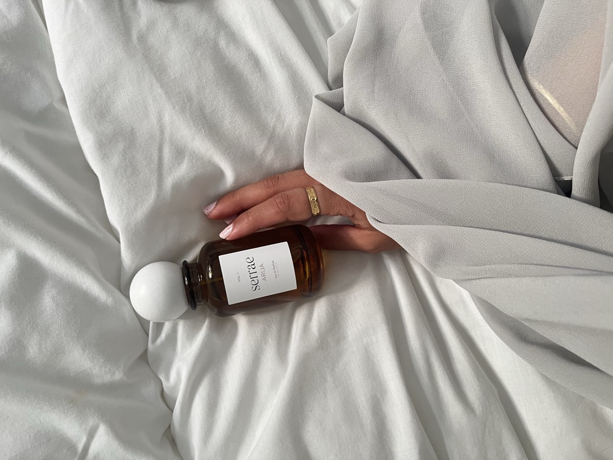 Serrae Arija perfume held in hand